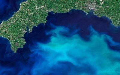 Feature image A vast expanse of deep blue water stretches across the ocean, reflecting sunlight under a clear sky.