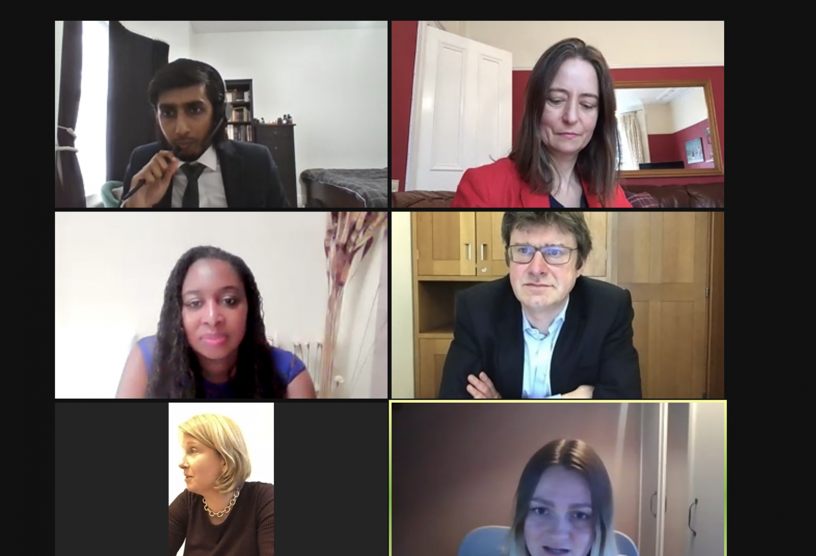 A diverse group of people participating in a video call, engaged in conversation and sharing ideas remotely