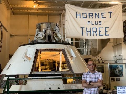 Mahesh Anand celebrating the Moon landing anniversary on the USS Hornet